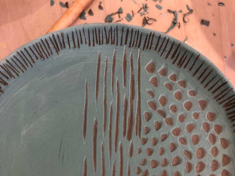 A piece of sgraffito pottery, decorated with lines and dots